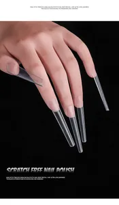 Detailed macro view showing clear extra long stiletto nail tips for professional extensions