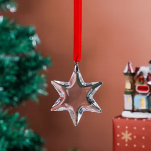 Close-up detail of a transparent crystal six-pointed star Christmas tree ornament