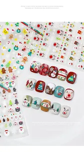 Detailed view of Christmas 3D nail art stickers featuring Santa and Snowman holiday designs