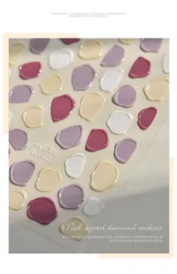 Macro view of 3D embossed wax seal nail stickers in macaron colors for DIY nail art