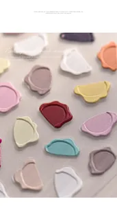 Detailed macro view of 3D embossed wax seal style nail stickers in macaron colors