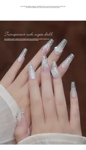 Macro view of transparent crystal butterfly and heart-shaped nail art charm details