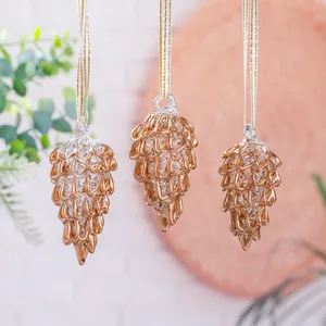 Handcrafted golden pinecone glass ornaments for Christmas tree with metallic scales