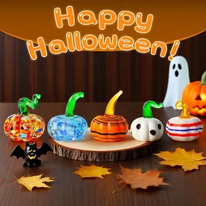 Detailed macro view of colorful handmade miniature glass pumpkin ornaments for Halloween.
