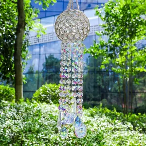 Macro view showing the AB color octagonal crystal beads on a golden sun catcher chime.