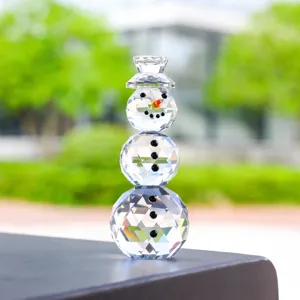 Macro view showing the faceted texture of a crystal snowman figurine for Christmas
