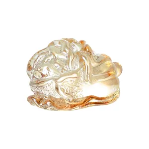 Detailed amber crystal cabbage ornament showing transparent texture and golden light.