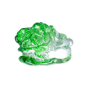 Detailed macro view of a green crystal cabbage figurine with translucent leaf textures