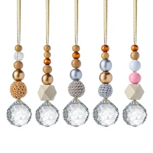 Handmade Christmas suncatcher ornaments featuring mixed wood beads and crystal balls