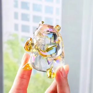 Detailed close-up of a colorful iridescent crystal hamster figurine being held in hand