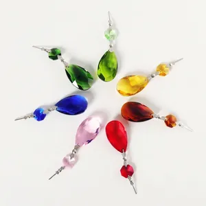 Detailed view of colorful teardrop crystal pendants for lighting decoration.