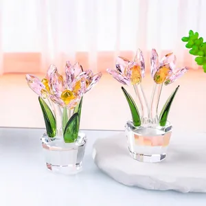 Detailed view of two exquisite pink faceted crystal tulip flower ornaments in clear pots.