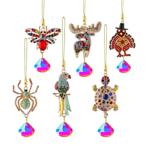 Set of six sparkling rhinestone animal ornaments with colorful faceted crystal drops