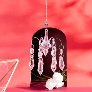 Sparkling crystal octopus chandelier suncatcher with teardrop prisms on red background