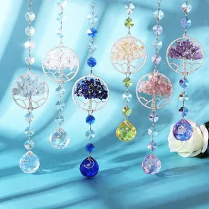Macro detail of colorful Tree of Life suncatchers with faceted crystal prism balls.