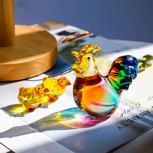 Detailed shot of vibrant crystal rooster and chick figurines with colorful reflections