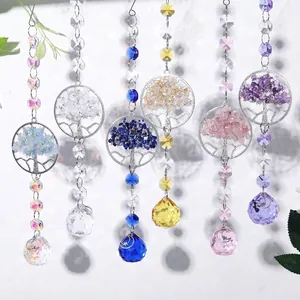Detail view of six sun catchers with Tree of Life designs and colorful crystal balls