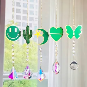 Decoratieve set van 5 kristallen zonnevangers met groene metalen vlinder- en hartmotieven