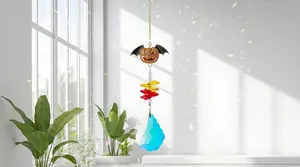 Elegant Halloween crystal suncatcher featuring a jeweled pumpkin bat and blue prism