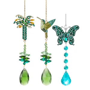 Set di tre acchiappasole in cristallo con colibrì, farfalla e palma per decorazione.