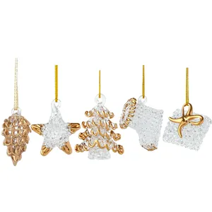 Set of 5 glass Christmas ornaments with gold accents, star, tree, and pine cone shapes.