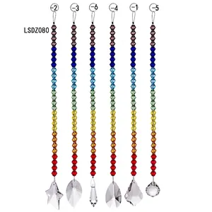 Detail view of rainbow crystal suncatchers with various clear geometric pendants