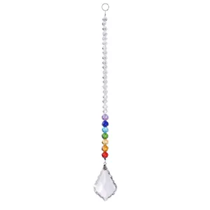 Detailed view of faceted crystal suncatcher with rainbow chakra beads and leaf pendant