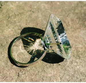 Close-up of 150mm oversized crystal diamond ring ornament with rainbow refraction.
