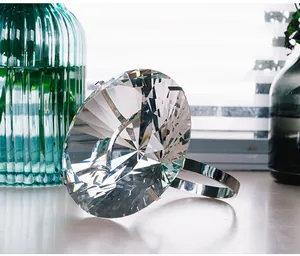 Macro view of a 150mm clear crystal diamond ring ornament on a white table