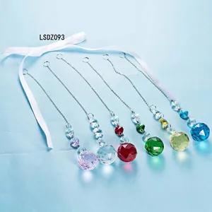 Collection of colorful faceted crystal suncatchers with metal chains for lighting decor