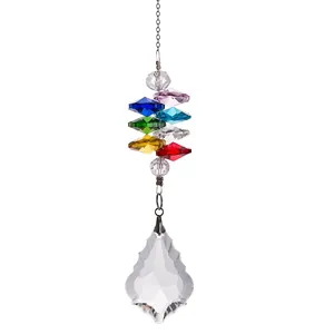 Detail showing a multi-colored crystal suncatcher with a clear faceted glass pendant.