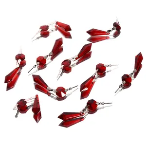 Close-up view of faceted red crystal spear pendants for DIY lighting accessories
