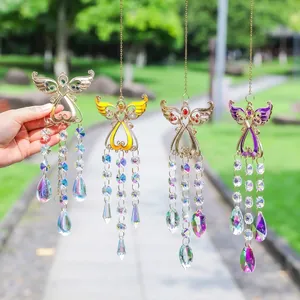 Close-up of four colorful angel wing crystal suncatchers hanging in a sunny garden.