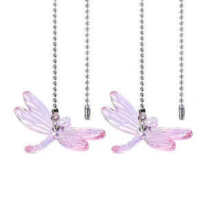 Set of two purple crystal dragonfly suncatchers with metal bead chains for garden decor.