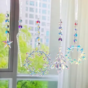 Iridescent acrylic suncatcher ornaments set with Christmas tree and wreath designs.