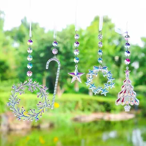 Detailed view of iridescent acrylic suncatchers in various festive Christmas shapes
