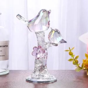 Iridescent crystal birds on a branch figurine with macro view of rainbow glass texture