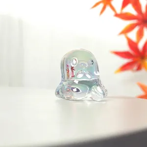 Macro detail showing the iridescent finish on a cute crystal cartoon ghost ornament