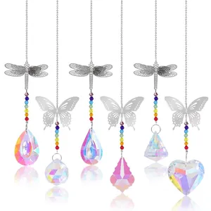 Various crystal suncatchers featuring metal dragonfly and butterfly charms with rainbow beads