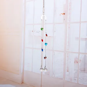 Detail view of crystal suncatcher with colorful heart beads and faceted balls