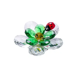 Faceted crystal flower figurine with a red ladybug on top for home decor