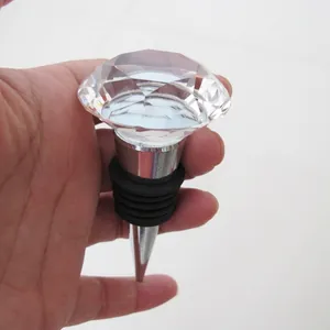 Detailed close-up of a 40mm clear crystal diamond wine bottle stopper held in hand