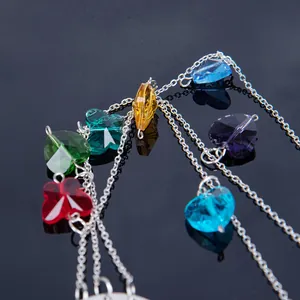Close-up of multi-colored faceted crystal beads on silver chains for garden decoration.
