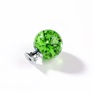 Detailed view of a green ice-crack crystal ball knob for furniture cabinet doors
