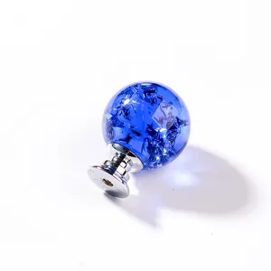 Detailed view of a blue ice crackle crystal sphere cabinet knob with chrome base