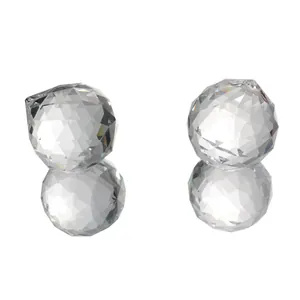 Macro detail view of faceted crystal glass lamp pendants showing high light refraction