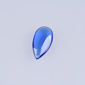 Detailed view of a large 18x33mm blue teardrop-shaped glass bead for DIY jewelry making
