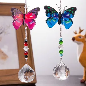 Close-up of butterfly crystal suncatcher with faceted glass ball for window home decoration