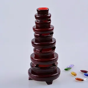 Set of dark mahogany finished circular wooden stands for crystal ball and stone display