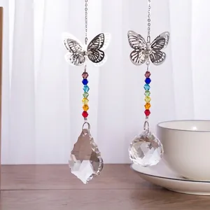 Detail view of butterfly crystal suncatchers featuring rainbow beads and faceted glass pendants